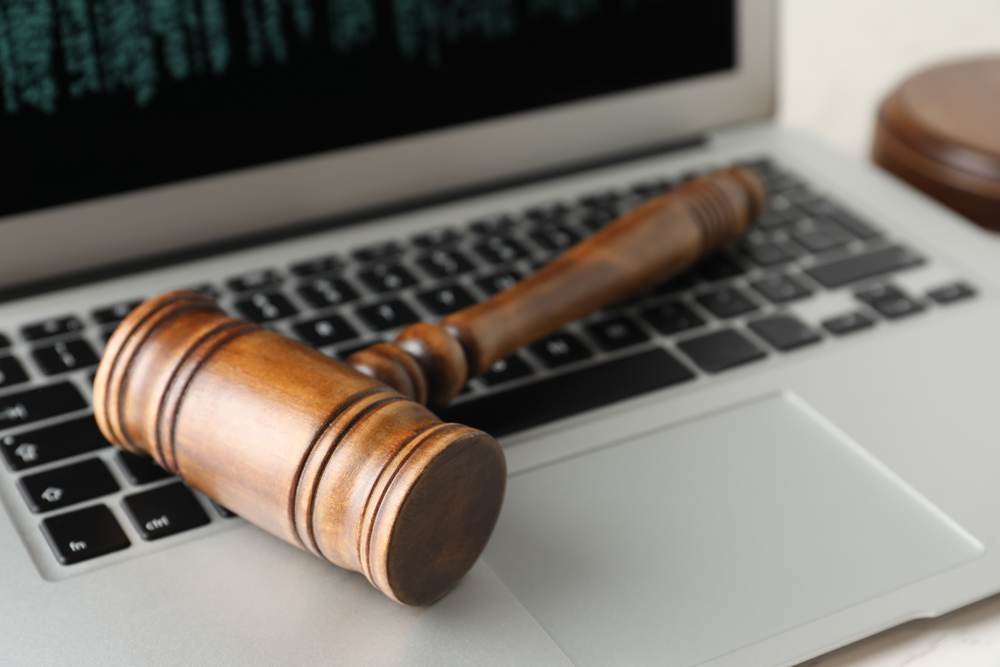 Image containing gavel on a laptop on the about page the Nigerian Law forum.